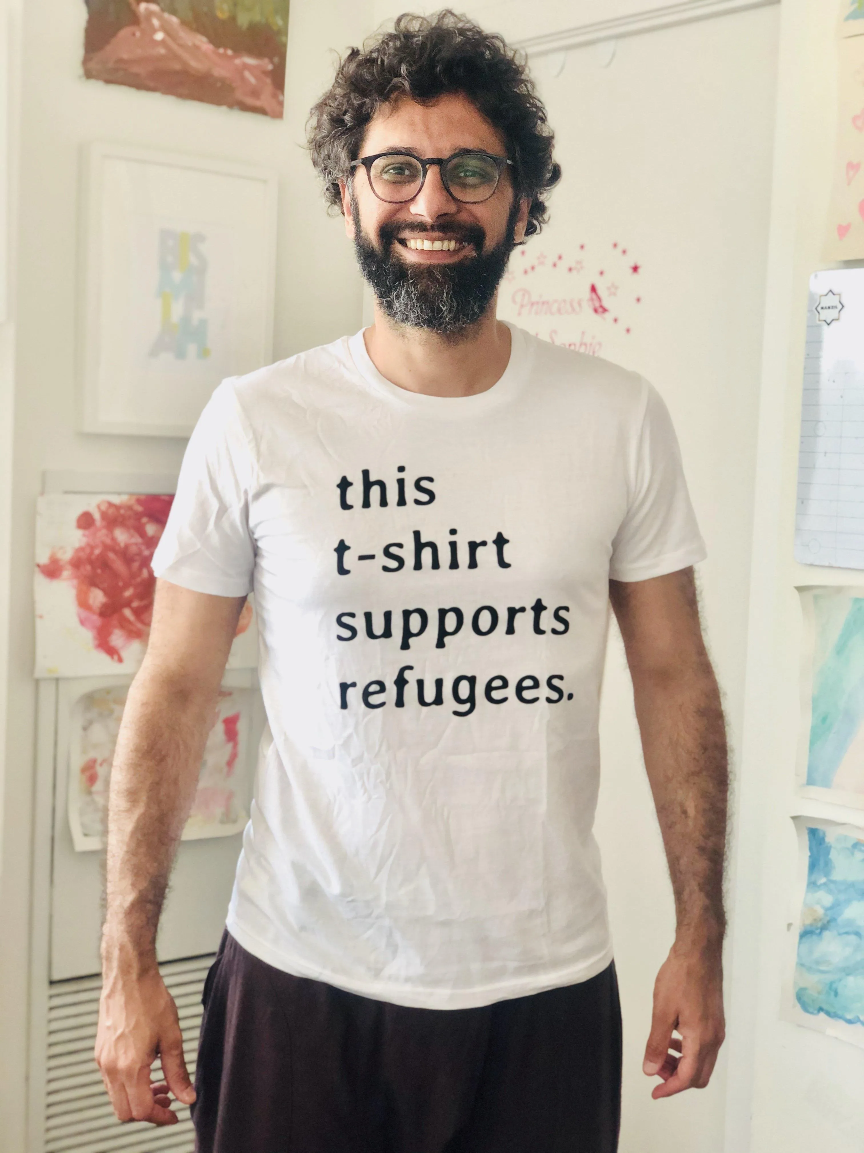 Sitti x UNHCR: "this t-shirt supports refugees." Unisex T-Shirt.