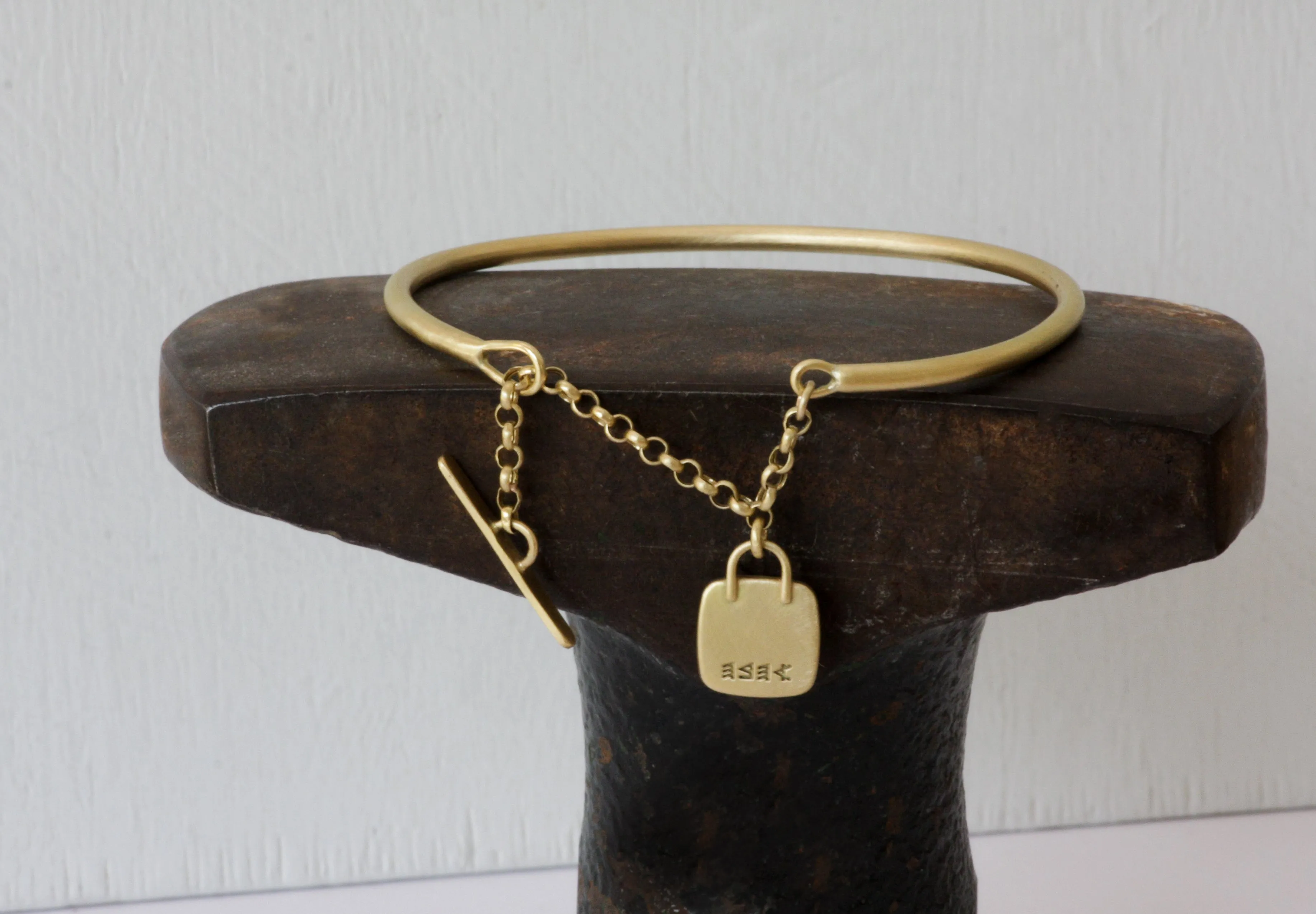 Solid Gold Open cuff bracelet with chain closure