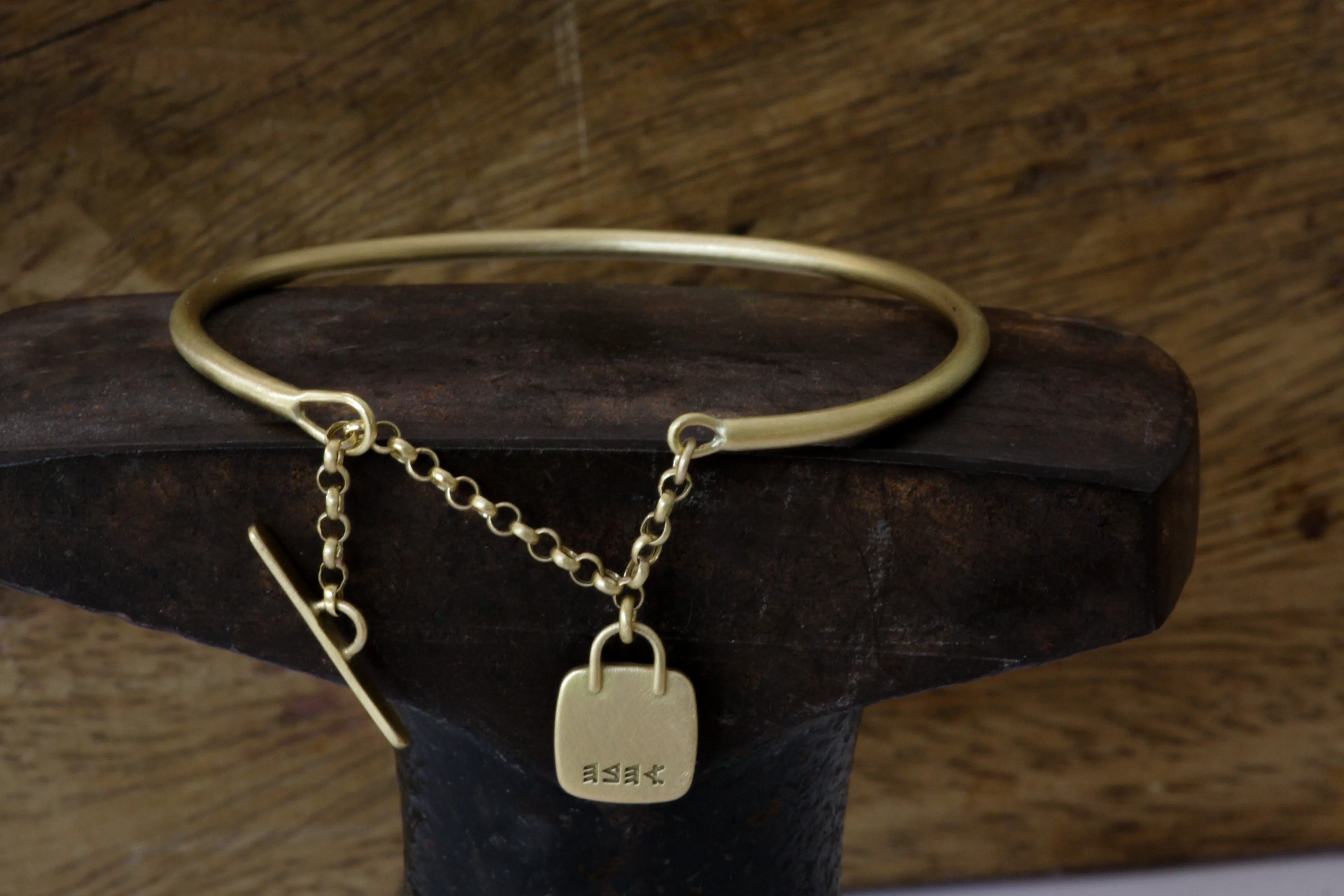 Solid Gold Open cuff bracelet with chain closure