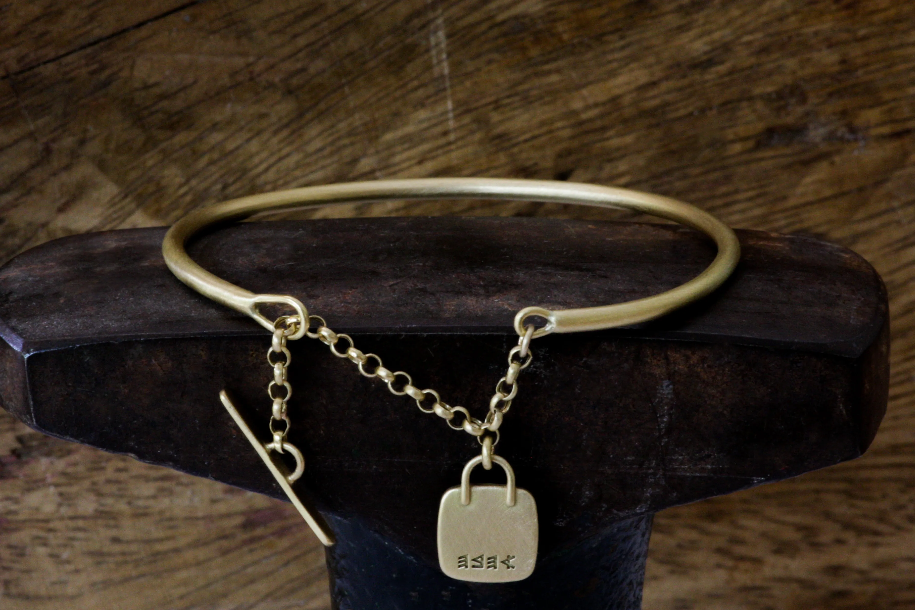 Solid Gold Open cuff bracelet with chain closure